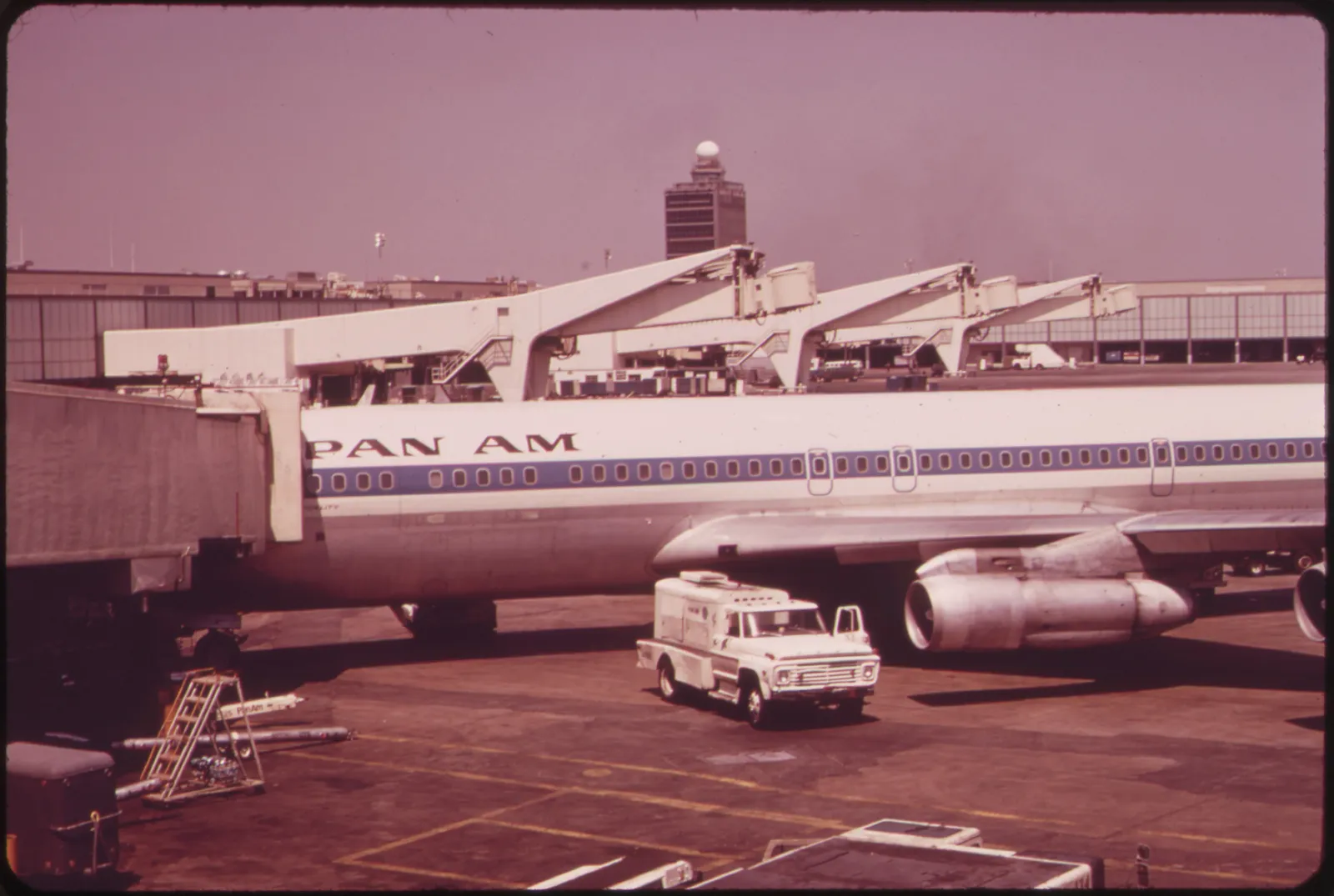 A Pan Am Boeing 707 at a gate at John F. Kennedy International Airport